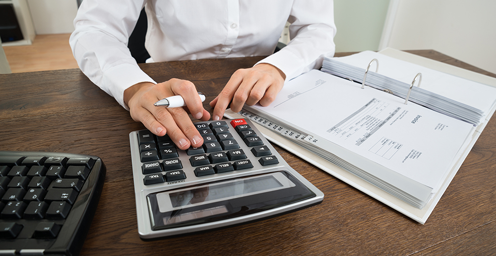 Businessperson Calculating Financial Expenses